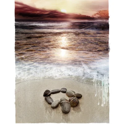Sunset oceanscape with a beach meditation or "land art visual prayer" of stones in a circle with a white line connecting them